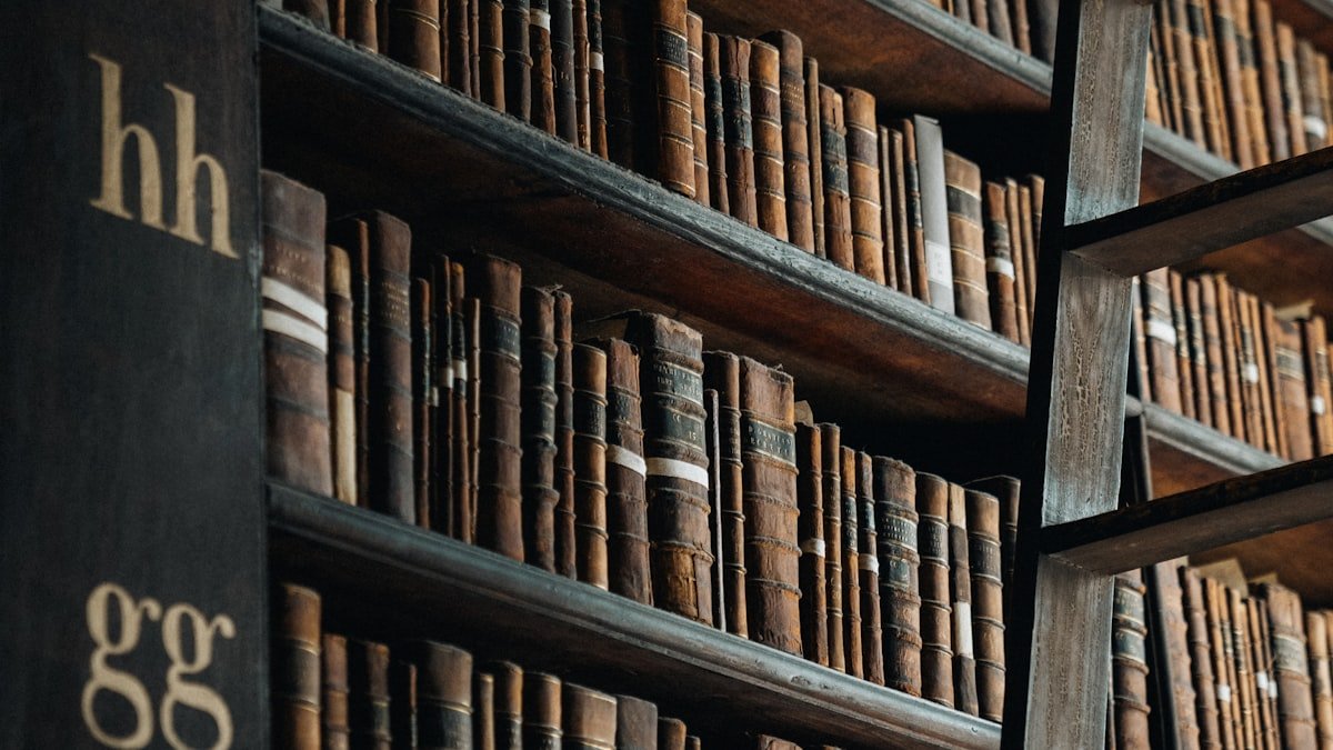 A bookshelf filled with self-improvement and personal growth books in a library