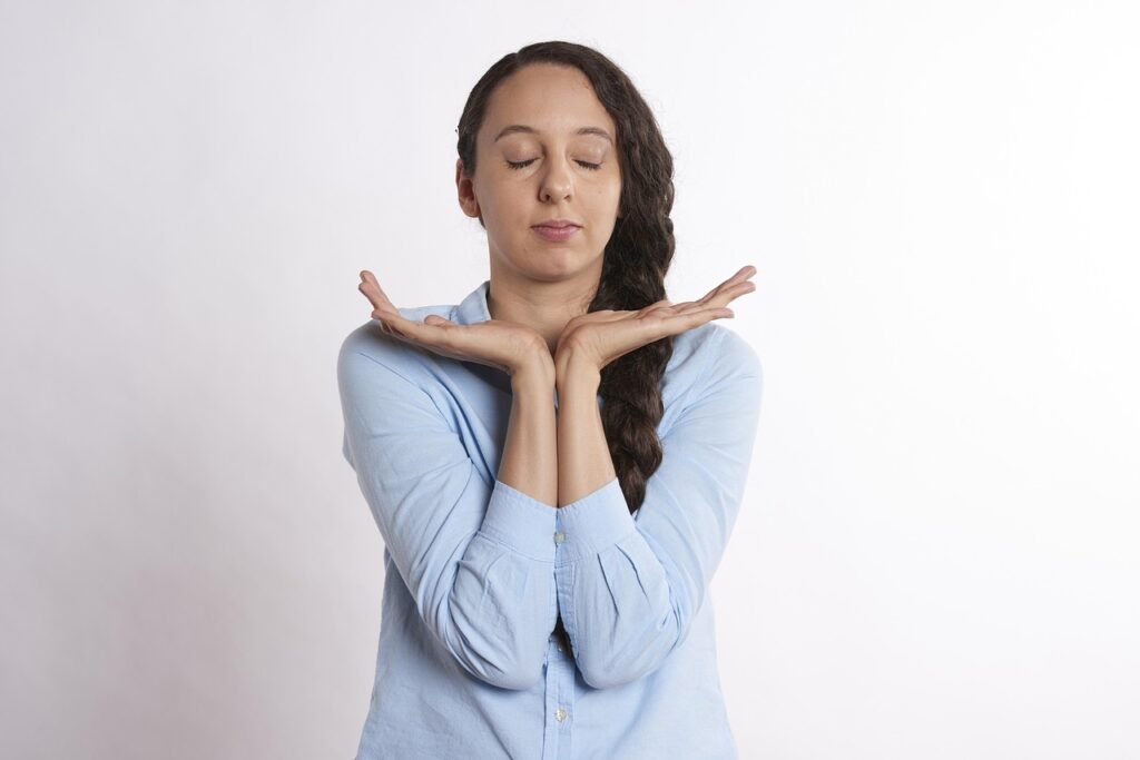 Woman practicing calm, thoughtful self-compassion meditation